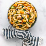 Mediterranean Pasta in a unique metal pot with a blue and white strip napkin tied around the handle