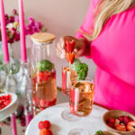 strawberry basil rose sangria in white wine glasses in valentines decor