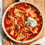Lasagna Soup in a bowl with a dollop of ricotta